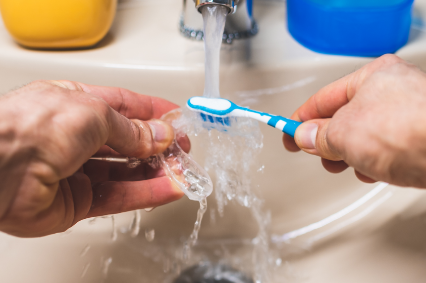 Get into the habit of cleaning your aligners regularly.